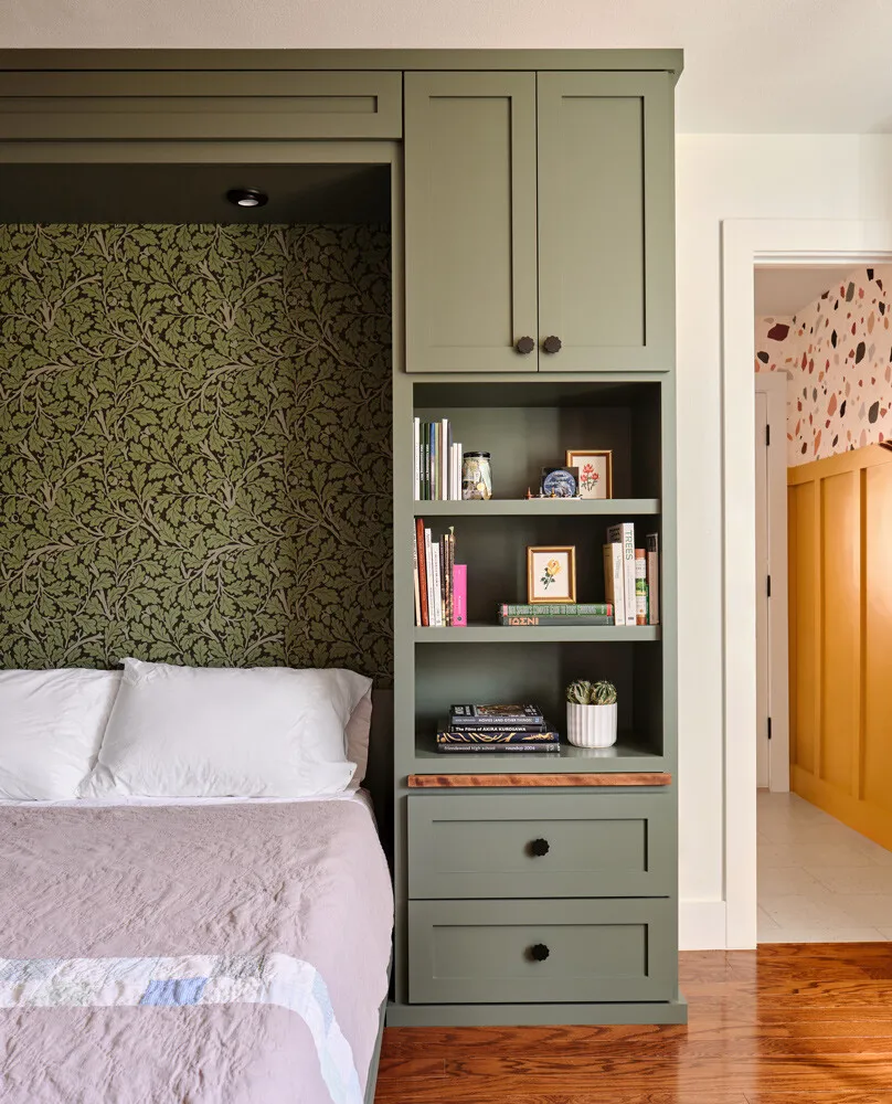 Murphy bed wall with open shelves beside a doorway