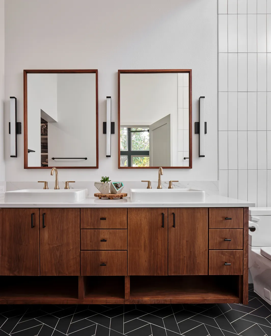 Bathroom remodel with double sinks and a walnut vanity