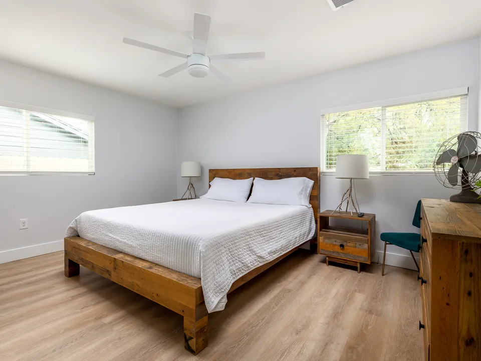 Bedroom with a wood bed frame and matching nightstands