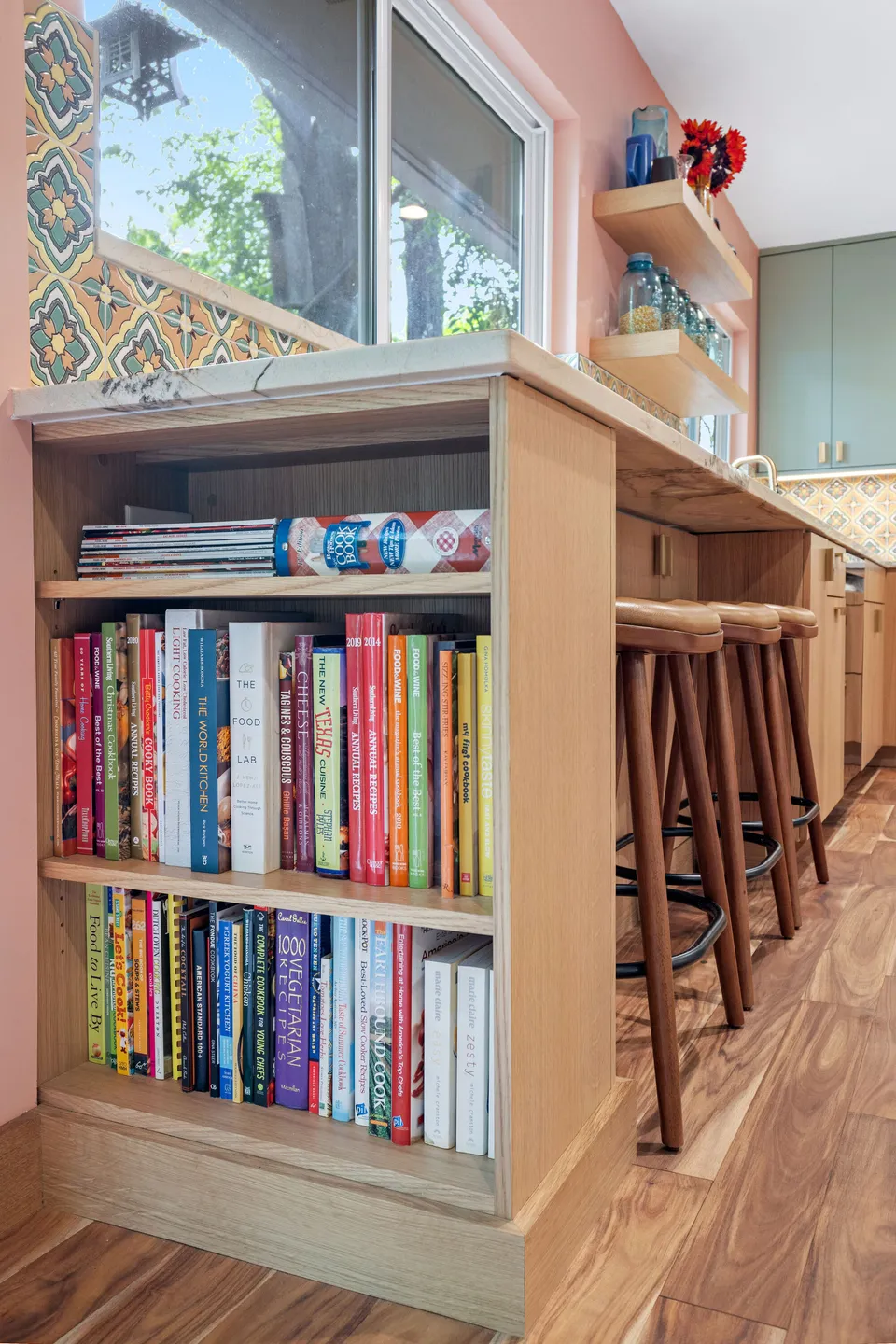 End of the peninsula with a built-in bookshelf of cookbooks