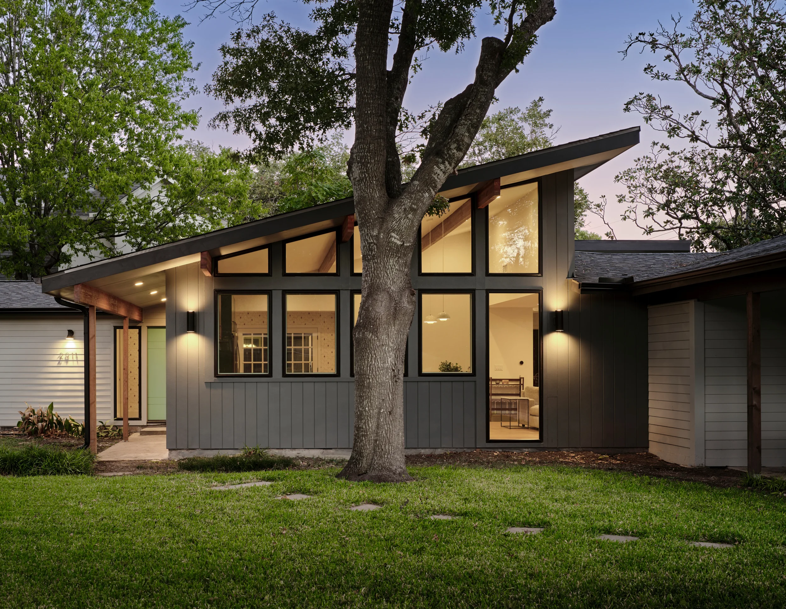 Mid-century modern home remodel in Austin at dusk