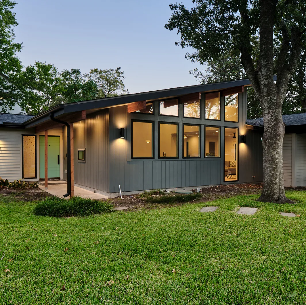 Home addition with clerestory windows and board-and-batten siding