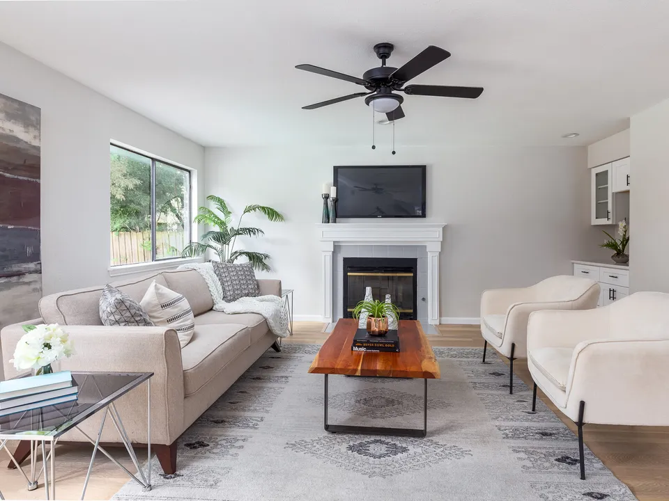 Living room with a live-edge coffee table facing the fireplace