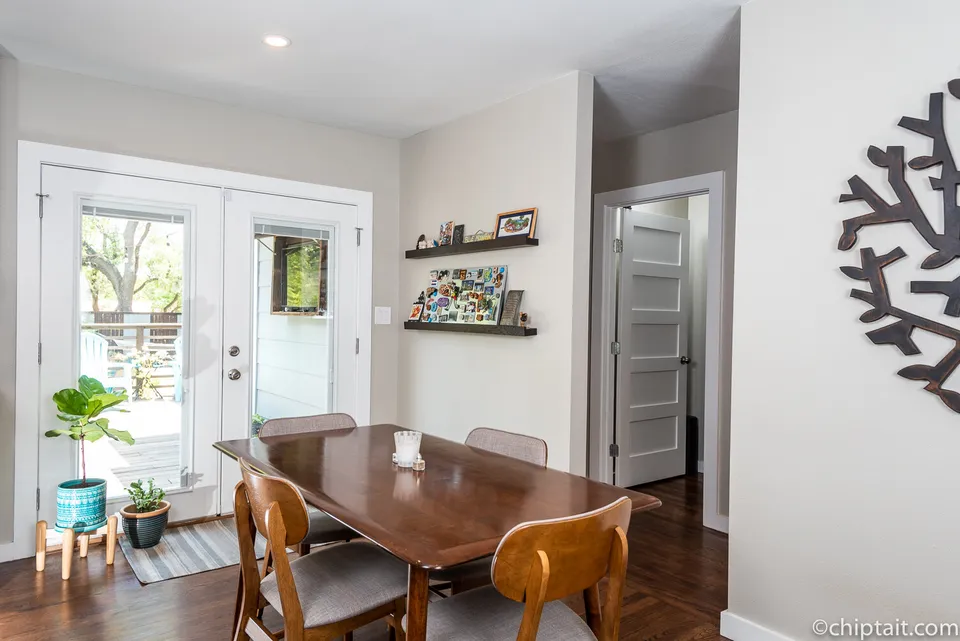 Dining room with a wood table and French doors to the yard