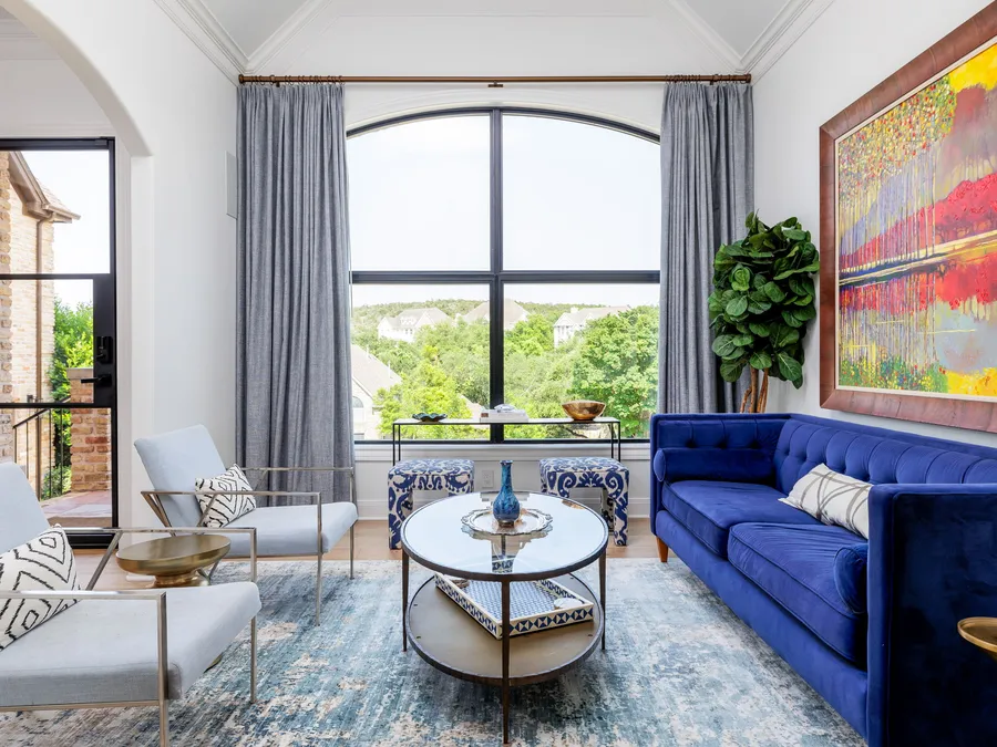 Living room with tall arched windows